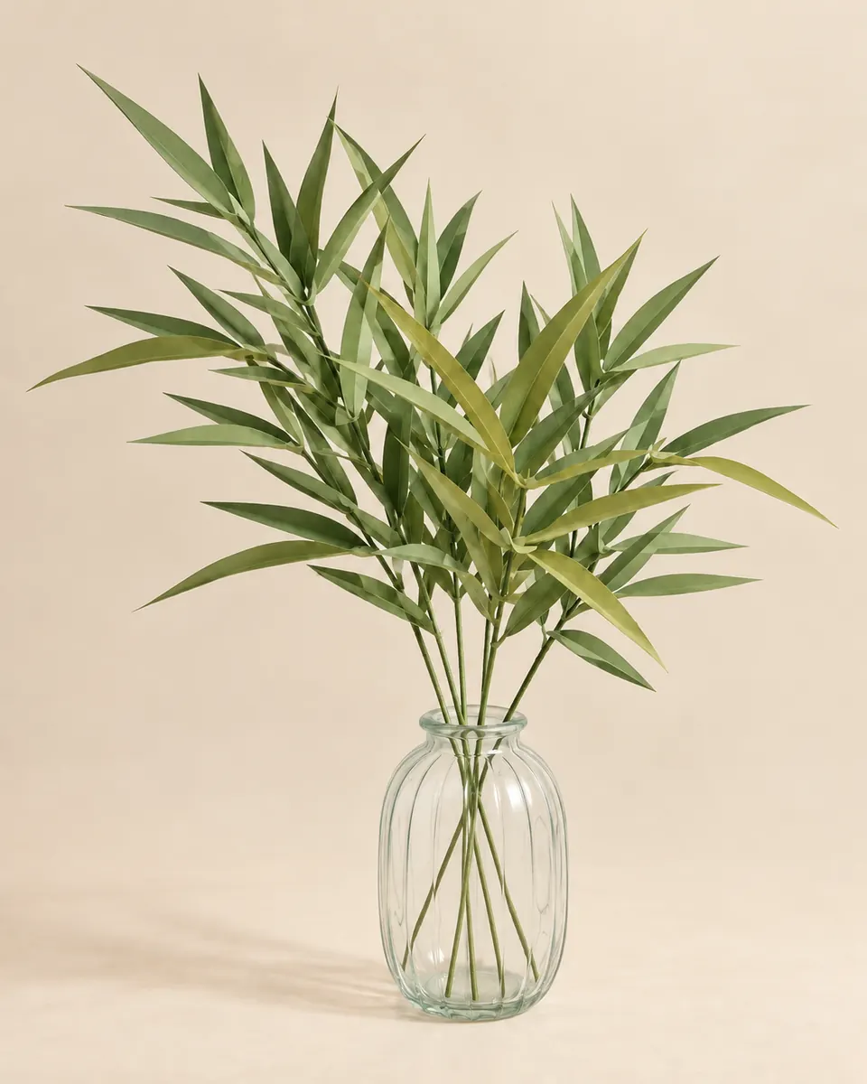 Herbes ornementales en papier vert pomme dans un vase en verre
